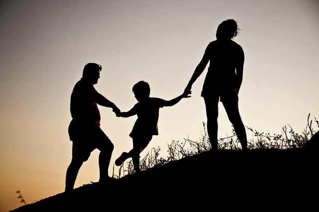 family climbing hill